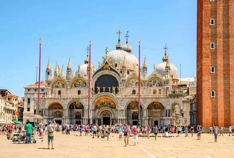Visitors admiring Byzantine mosaics on a skip-the-line St Mark's Basilica ticket visit in Venice, Italy